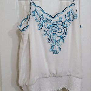 White silky blouse with blue embroidery